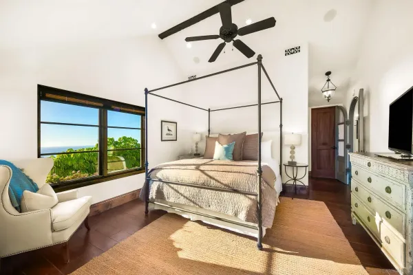 a bedroom with a bed and window