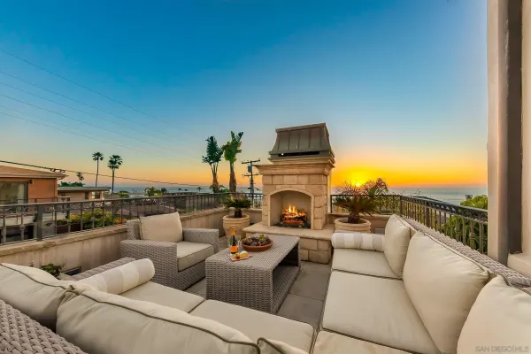 an aerial view of a house with a yard and a fountain