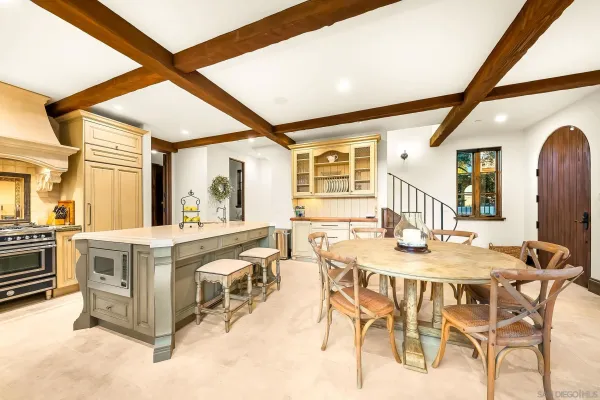 a kitchen with a stove a sink and a window