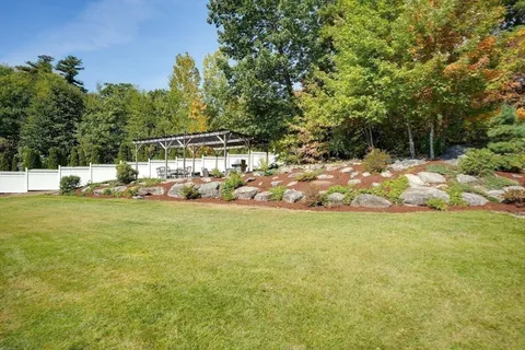 a aerial view of a house with swimming pool