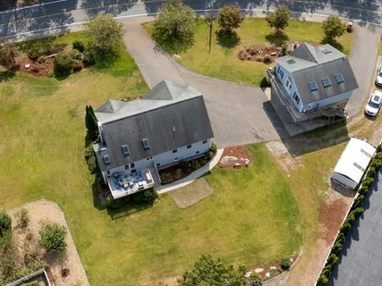 an aerial view of a house with a swimming pool