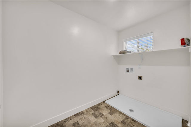 5875 Challenger Way St. George, UT 84790 - Photo 8 of 18 Utility room featuring a window with horizontal blinds, a white wall shelf, and hookups for appliances