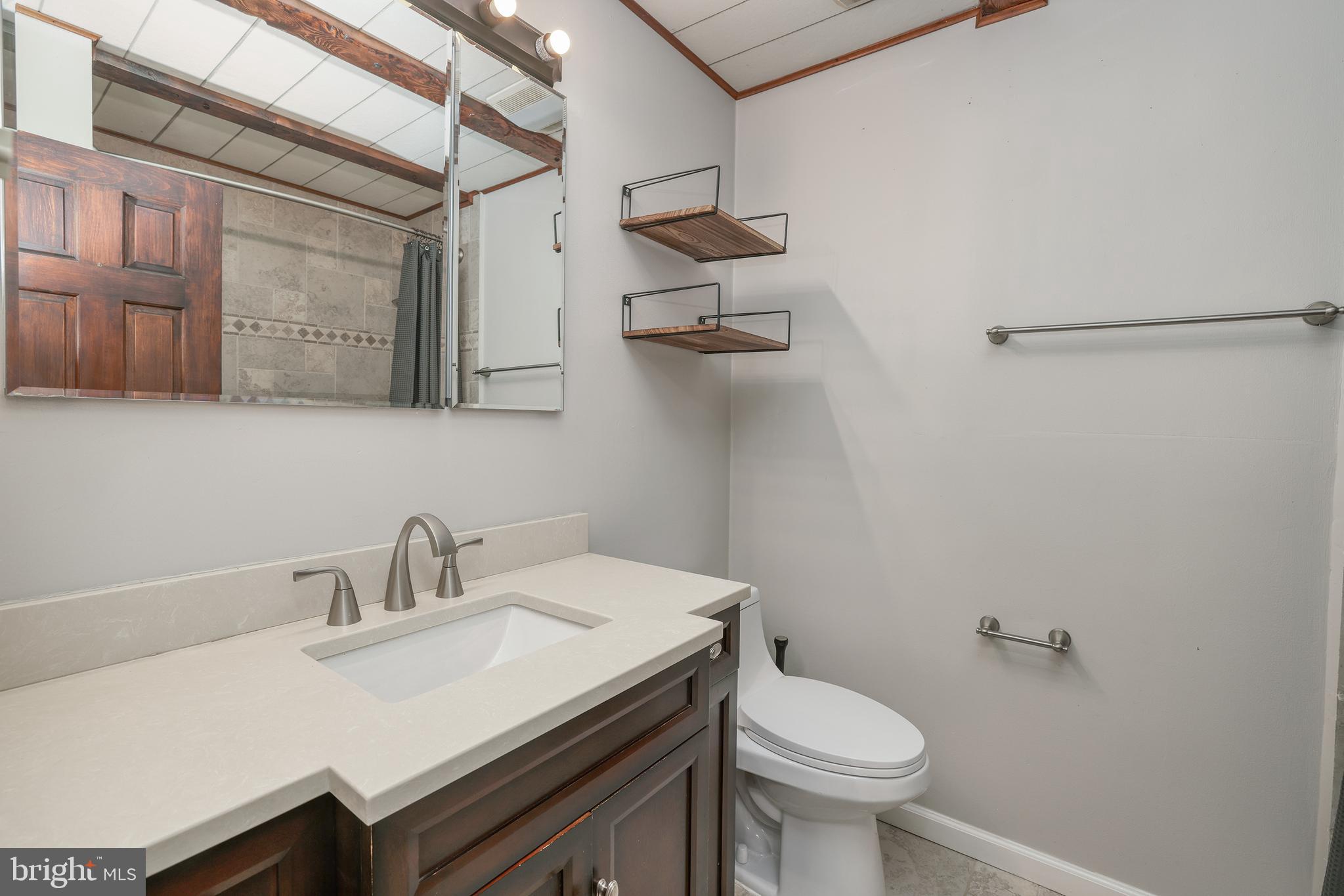6 Van Gogh Court Ewing, NJ 08618 - Photo 16 of 25 a bathroom with a sink a toilet and a mirror