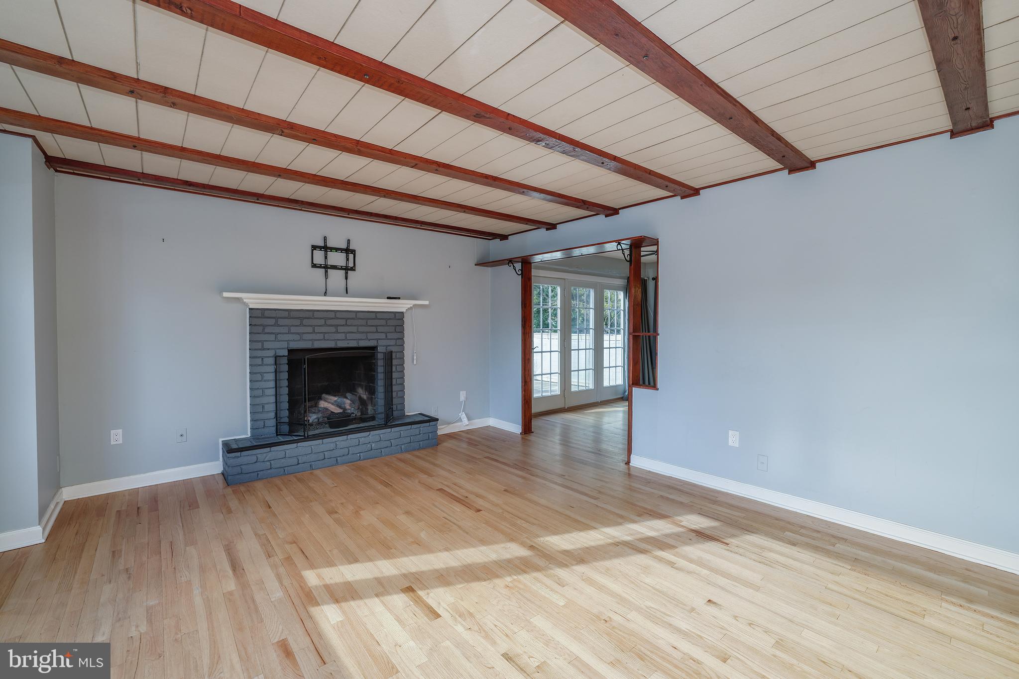6 Van Gogh Court Ewing, NJ 08618 - Photo 3 of 25 a view of empty room with wooden floor and fireplace