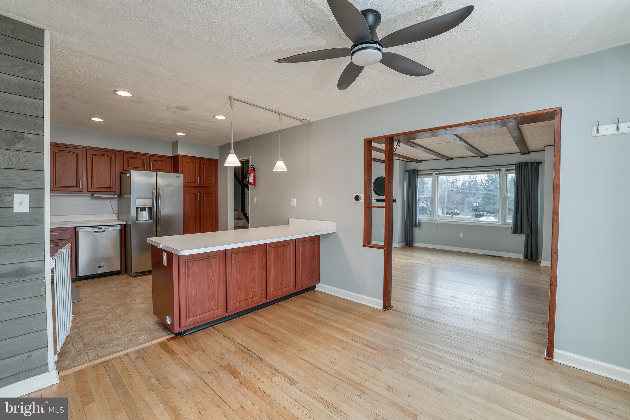 6 Van Gogh Court Ewing, NJ 08618 - Photo 4 of 25 a open kitchen with kitchen island wooden floors appliances and cabinets