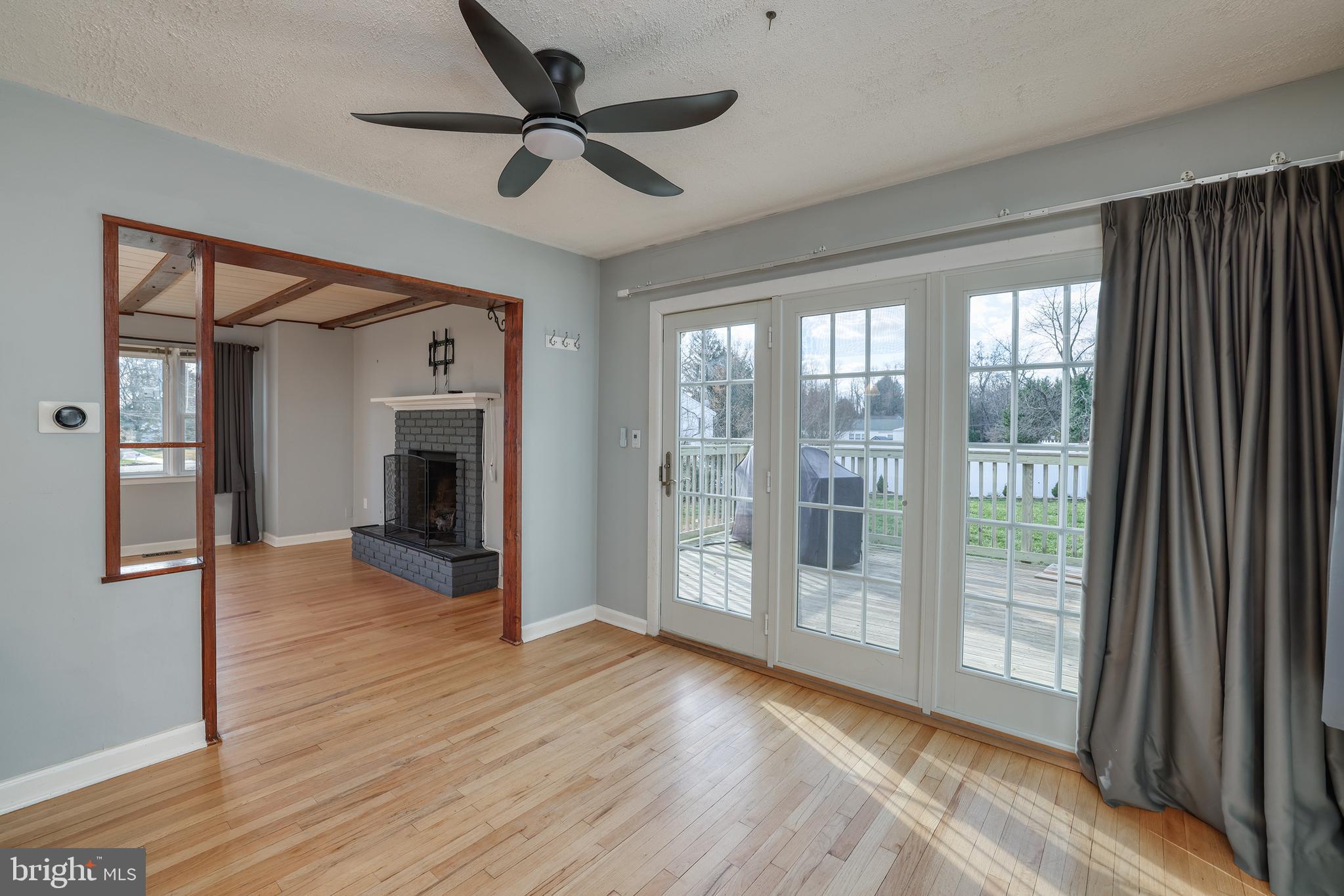 6 Van Gogh Court Ewing, NJ 08618 - Photo 7 of 25 a view of empty room with wooden floor and fan