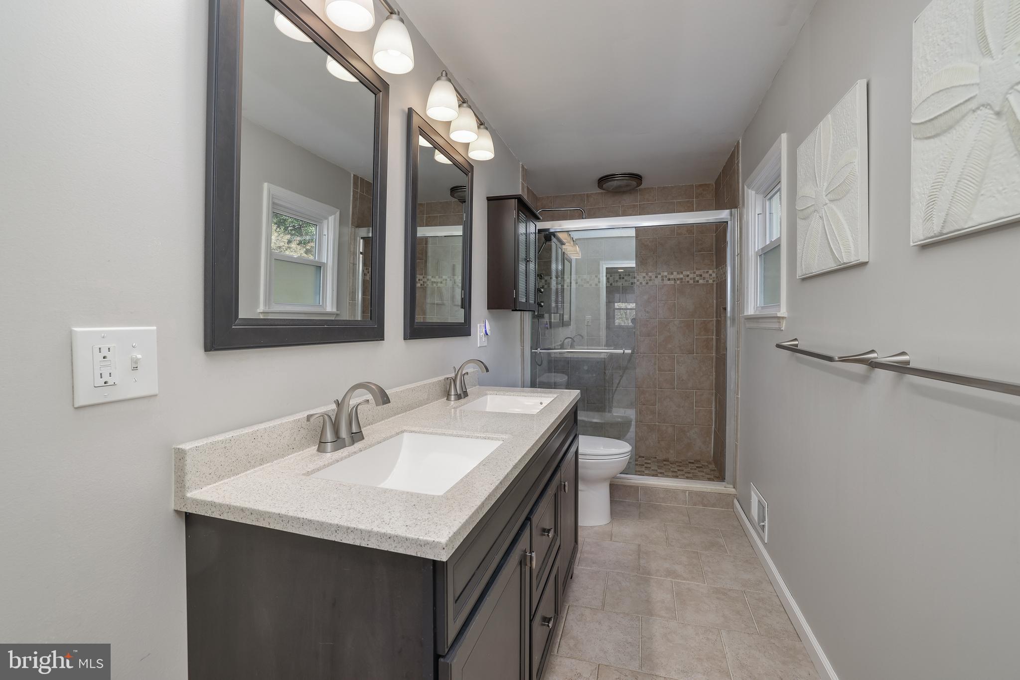 6 Van Gogh Court Ewing, NJ 08618 - Photo 10 of 25 a bathroom with 2 sink and a mirror