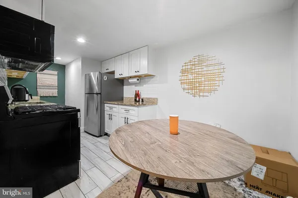 a kitchen with a sink a stove and refrigerator