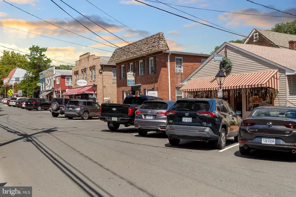 a view of a cars park in front of a building