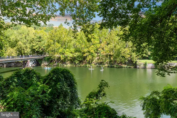 a view of a lake with a house in the background