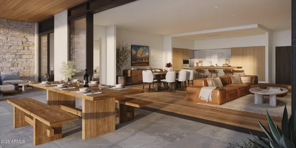 a living room with furniture and large windows