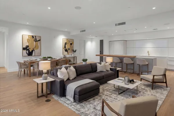 a view of a kitchen with kitchen island and a refrigerator