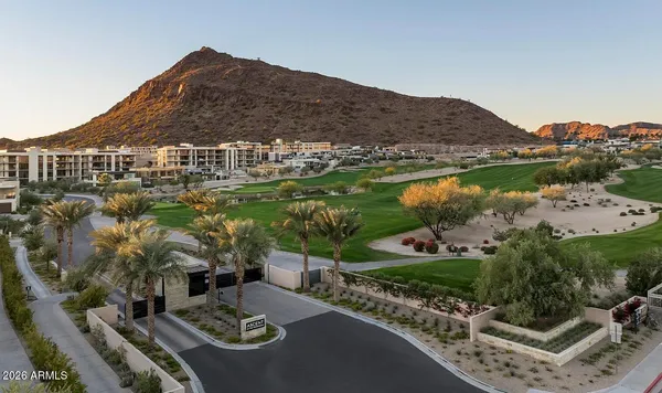 a view of a house with swimming pool and sitting area