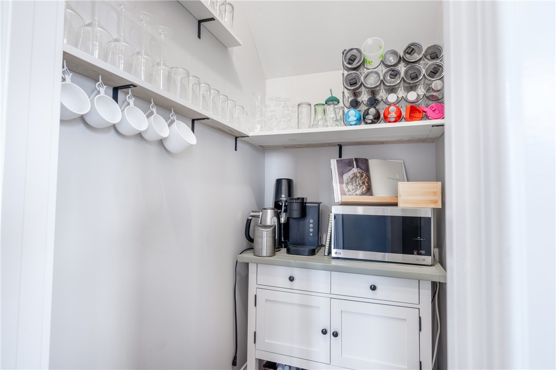 677 Lightwood Road Hartwell, GA 30643 - Photo 16 of 42 This thoughtfully organized space provides convenient storage and essential appliances for everyday living.