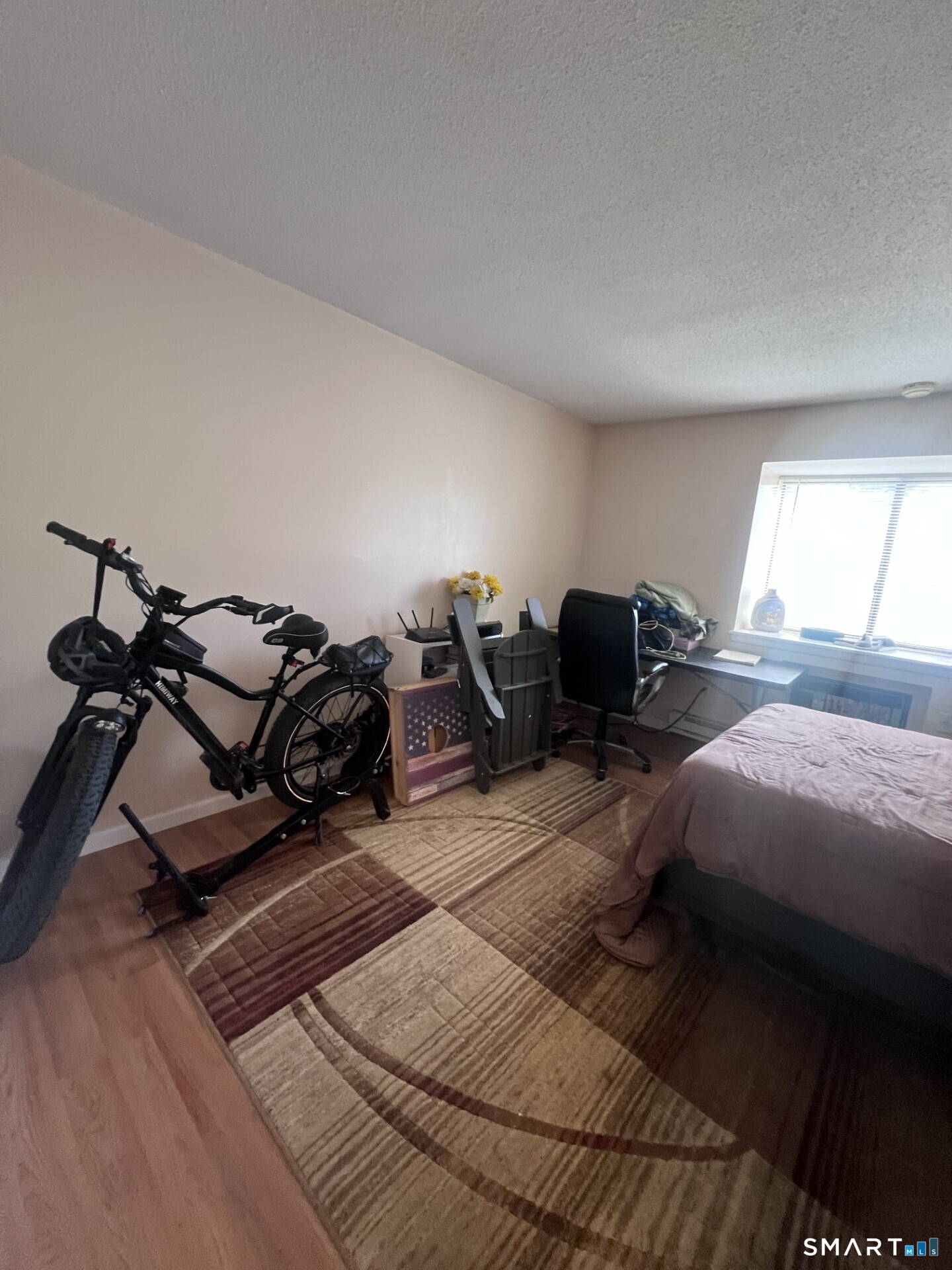 93 Kent Court, Unit 93 Meriden, CT 06450 - Photo 17 of 27 a bedroom with a bed and wooden floor