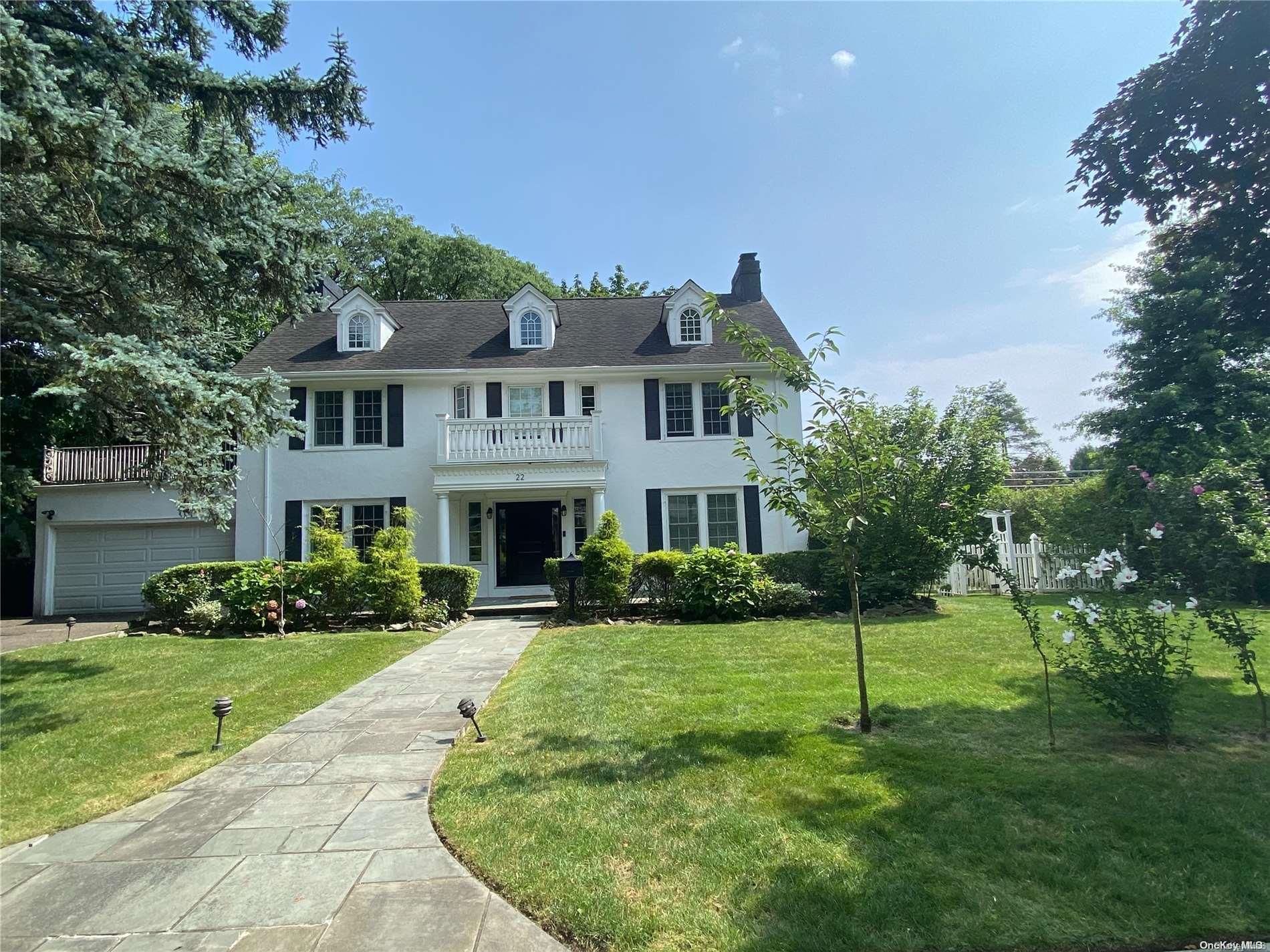 22 Beverly Road Great Neck, NY 11021 - Photo 1 of 1 a front view of a house with a yard