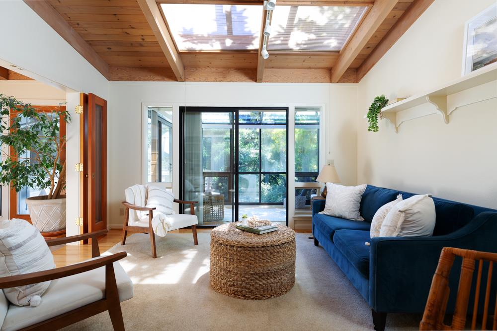 275 Aptos School Road Aptos, CA 95003 - Photo 11 of 45 a living room with furniture and a floor to ceiling window