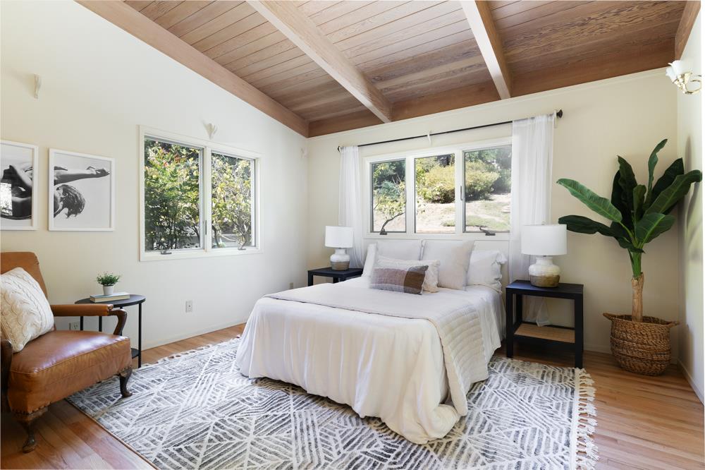 275 Aptos School Road Aptos, CA 95003 - Photo 15 of 45 a bedroom with a large bed and a couch