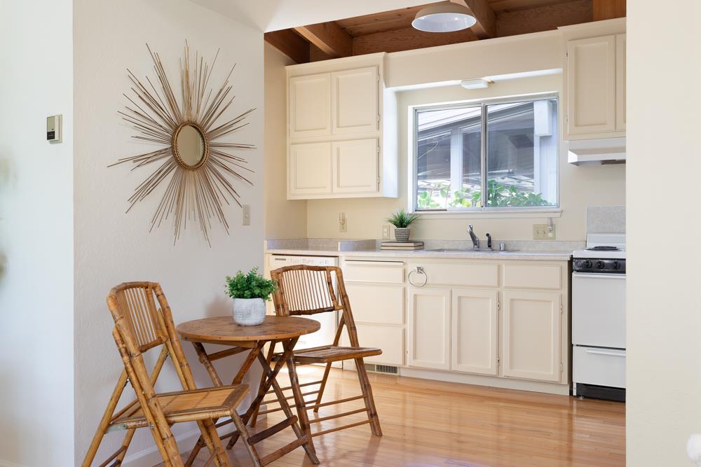 275 Aptos School Road Aptos, CA 95003 - Photo 18 of 45 a kitchen with stainless steel appliances white cabinets and a large window