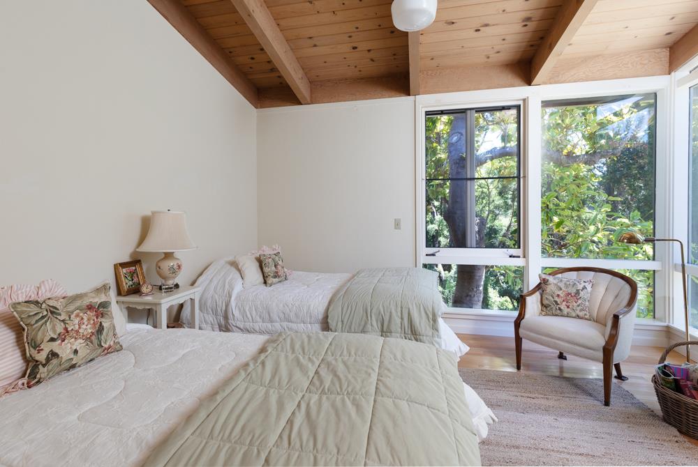 275 Aptos School Road Aptos, CA 95003 - Photo 22 of 45 a bedroom with furniture and a large window