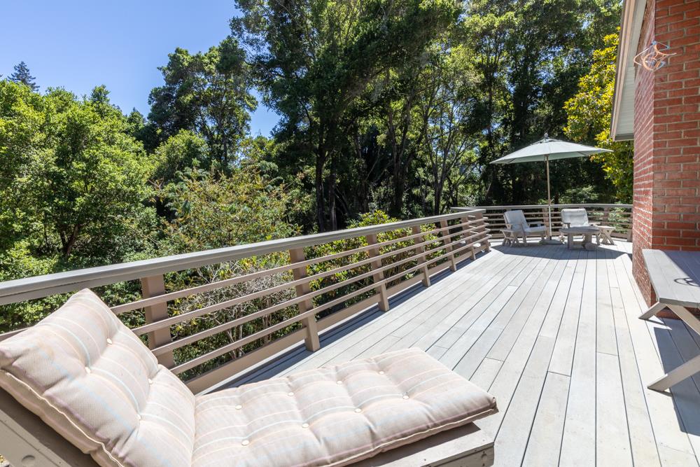 275 Aptos School Road Aptos, CA 95003 - Photo 35 of 45 a sitting area with furniture and umbrella