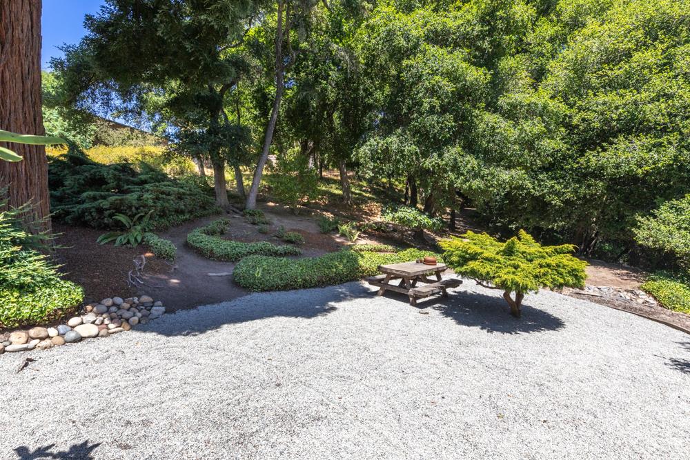 275 Aptos School Road Aptos, CA 95003 - Photo 40 of 45 a bench is sitting in the middle of a yard