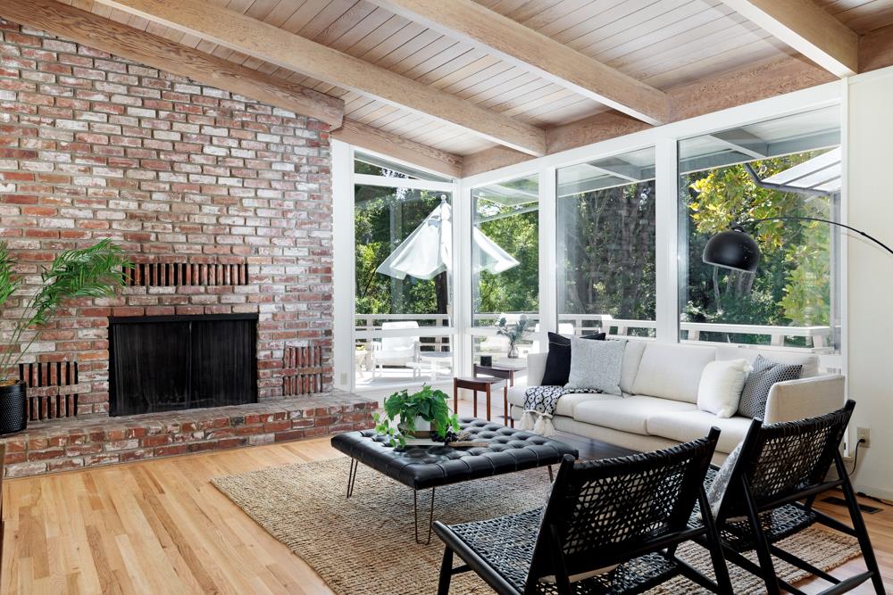 275 Aptos School Road Aptos, CA 95003 - Photo 6 of 45 a living room with patio furniture and a fireplace