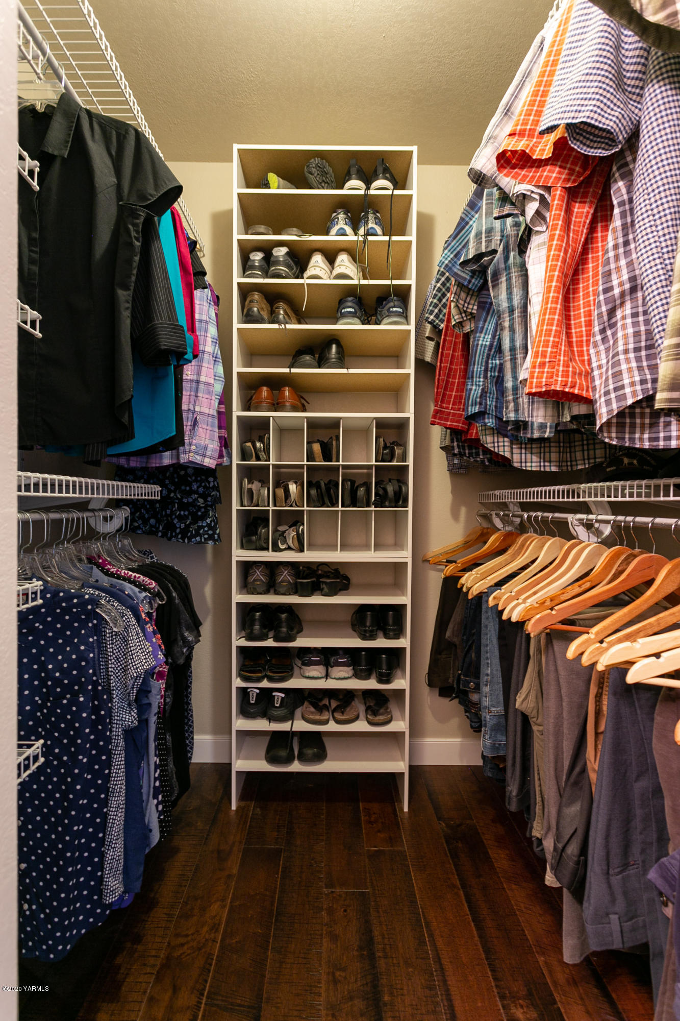 601 Brewer Road Grandview, WA 98930 - Photo 22 of 32 a view of walk in closet with clothes and shoes