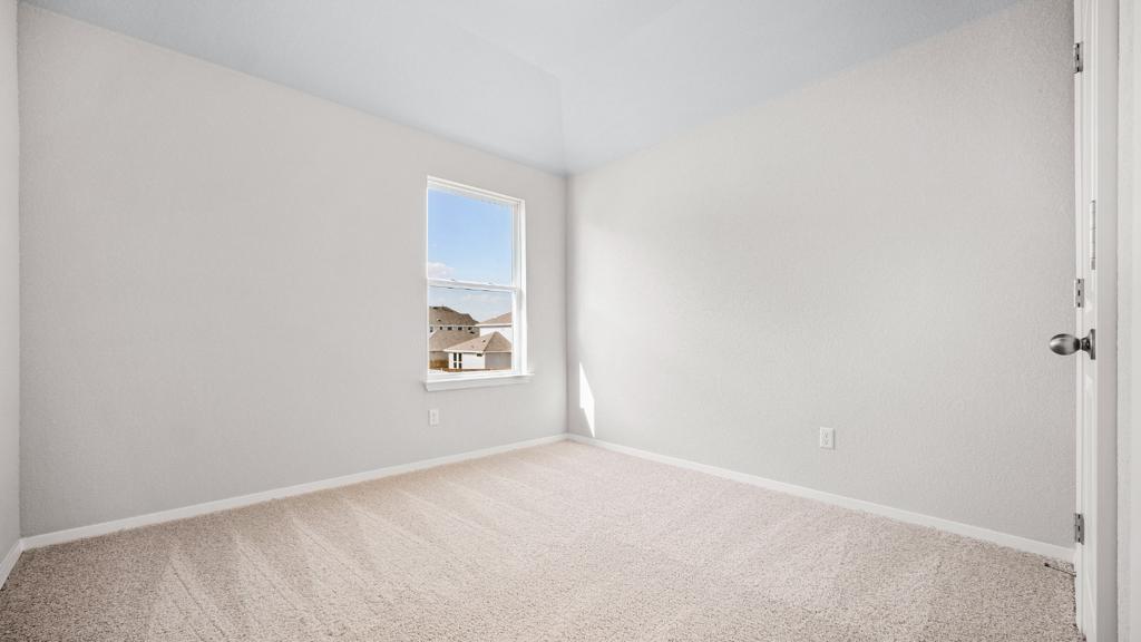 208 Stein Road Georgetown, TX 78626 - Photo 9 of 30 Carpeted empty room with baseboards