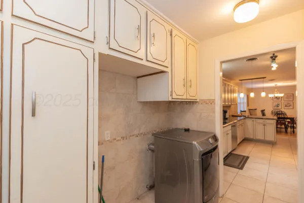 a kitchen with stainless steel appliances granite countertop a stove a sink dishwasher a refrigerator and a microwave