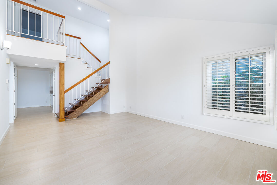 29202 Heathercliff Road Malibu, CA 90265 - Photo 12 of 20 a view of an empty room with stairs