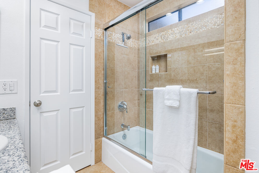 29202 Heathercliff Road Malibu, CA 90265 - Photo 18 of 20 a bathroom with a bathtub and a shower