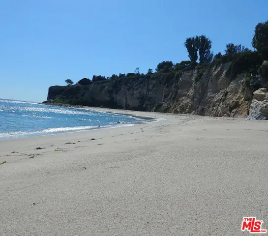a view of beach and mountain