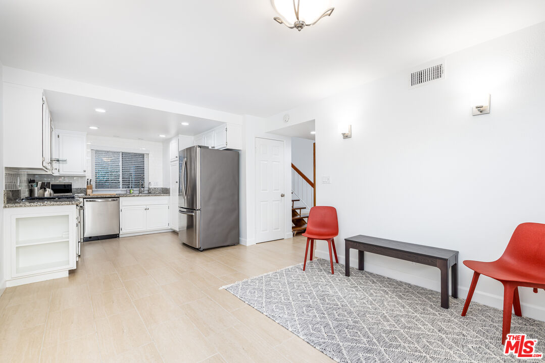 29202 Heathercliff Road Malibu, CA 90265 - Photo 9 of 20 a living room with furniture and kitchen view