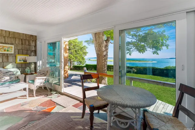 a view of a livingroom with furniture window and outside view