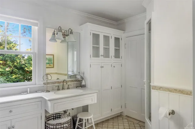 a bathroom with a sink and a mirror