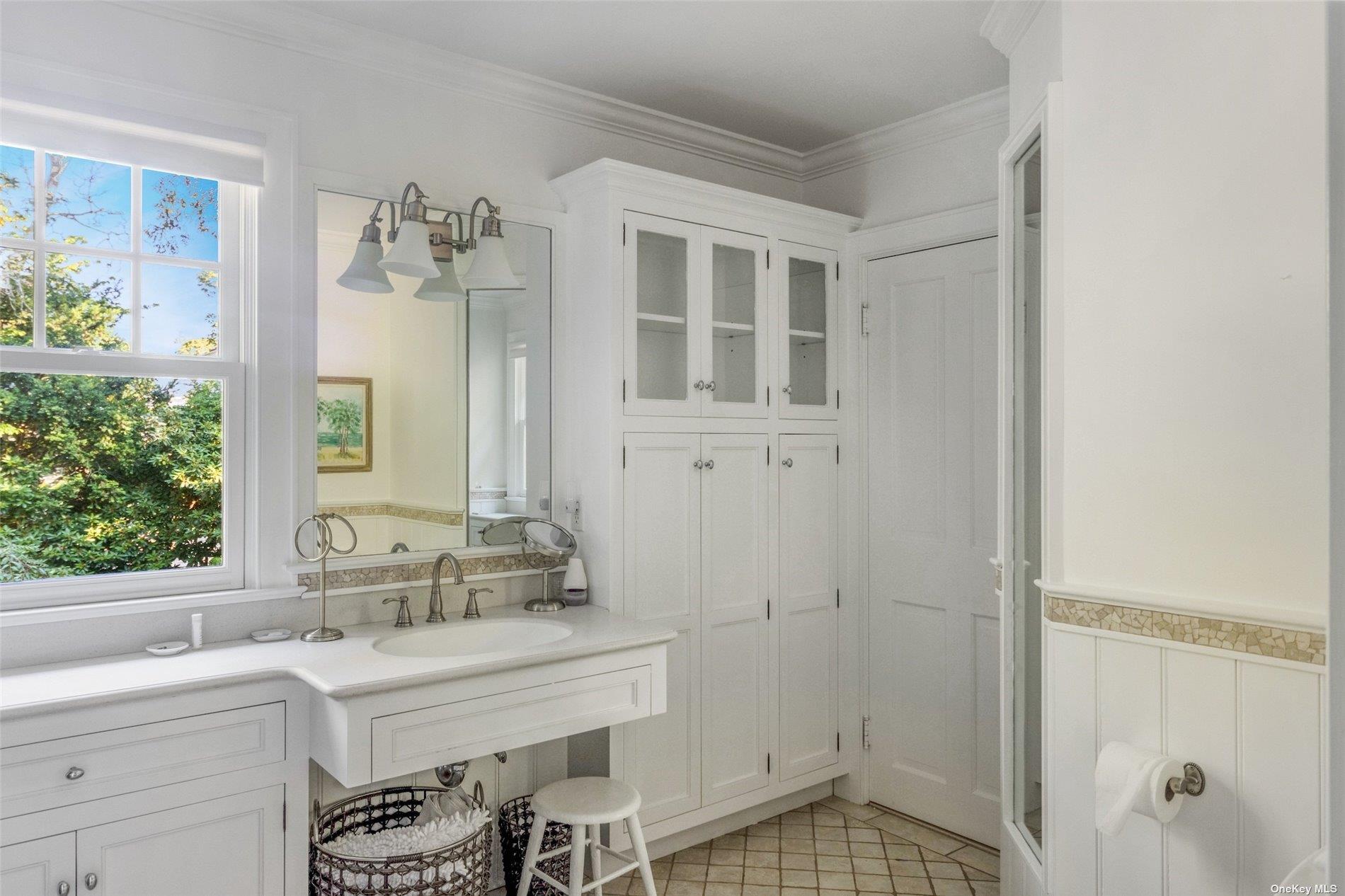 930 West Cove Road Cutchogue, NY 11935 - Photo 17 of 34 a bathroom with a sink and a mirror