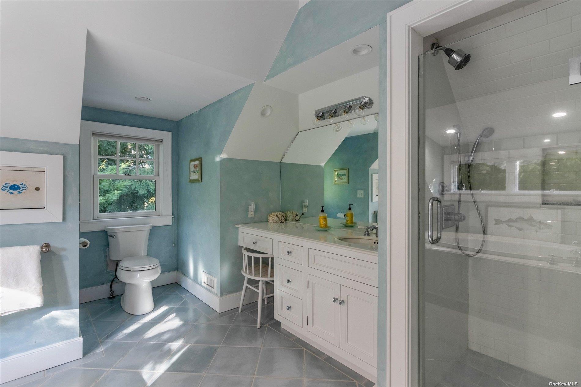 930 West Cove Road Cutchogue, NY 11935 - Photo 21 of 34 a bathroom with a toilet sink and mirror