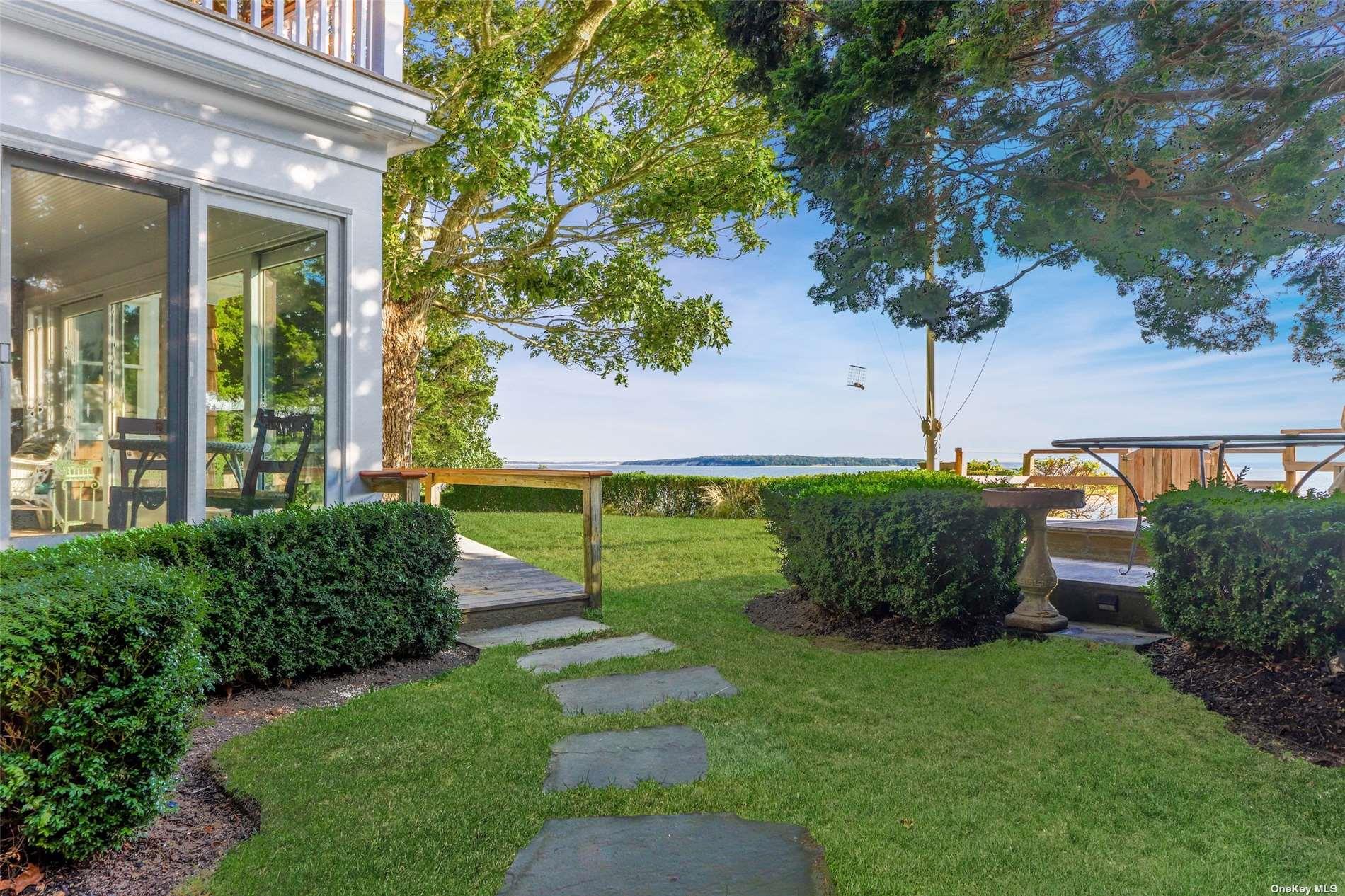 930 West Cove Road Cutchogue, NY 11935 - Photo 26 of 34 a front view of a house with garden