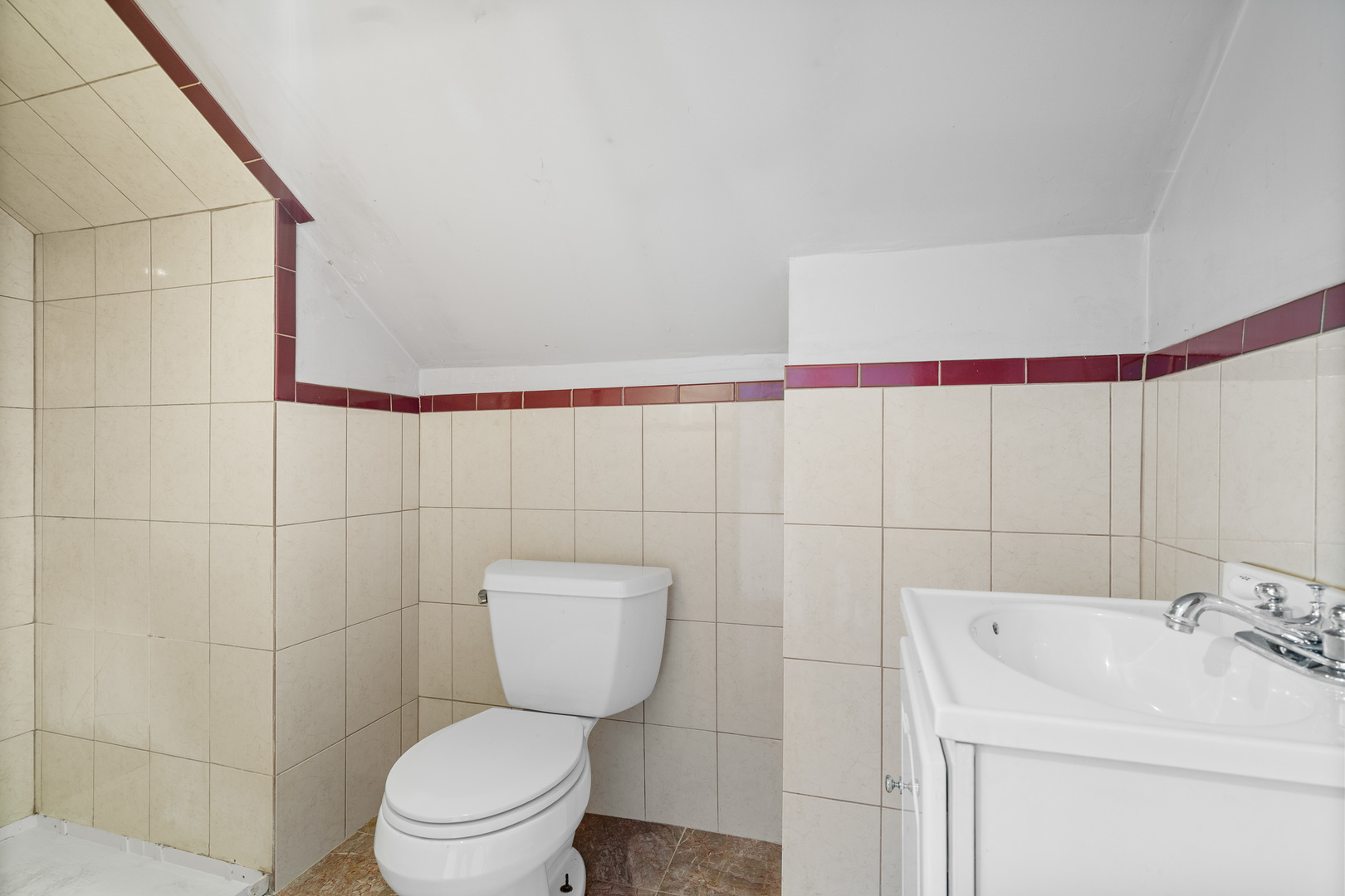 7845 45th Street Lyons, IL 60534 - Photo 17 of 31 a bathroom with a toilet sink and mirror
