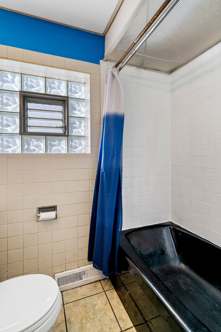 7845 45th Street Lyons, IL 60534 - Photo 7 of 31 a bathroom with a granite countertop sink toilet and shower