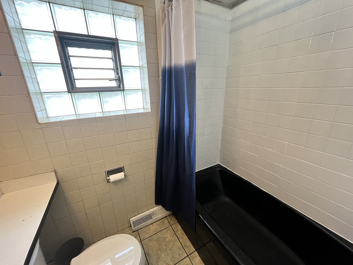 7845 45th Street Lyons, IL 60534 - Photo 8 of 31 a bathroom with a toilet a sink and a window