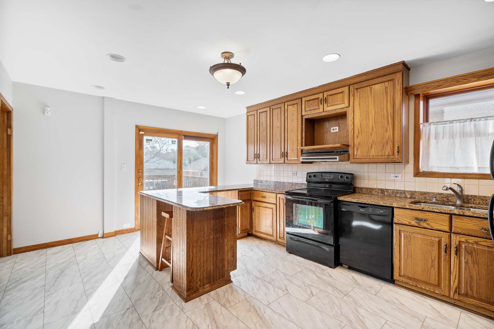 7845 45th Street Lyons, IL 60534 - Photo 10 of 31 a kitchen with a stove top oven sink and cabinets