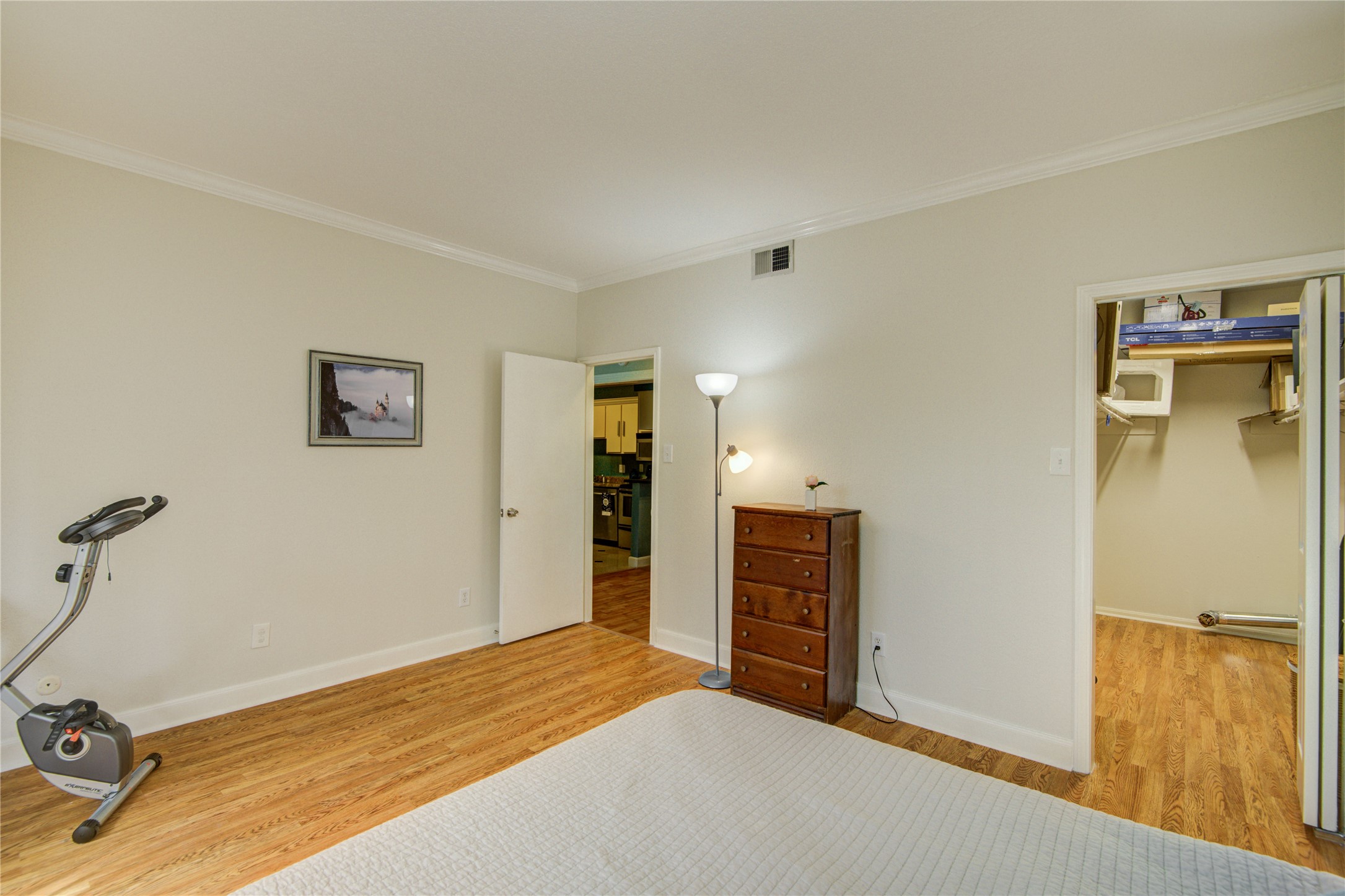 2100 Tanglewilde Street, Unit 349 Houston, TX 77063 - Photo 20 of 29 a bedroom with a bed and cabinets