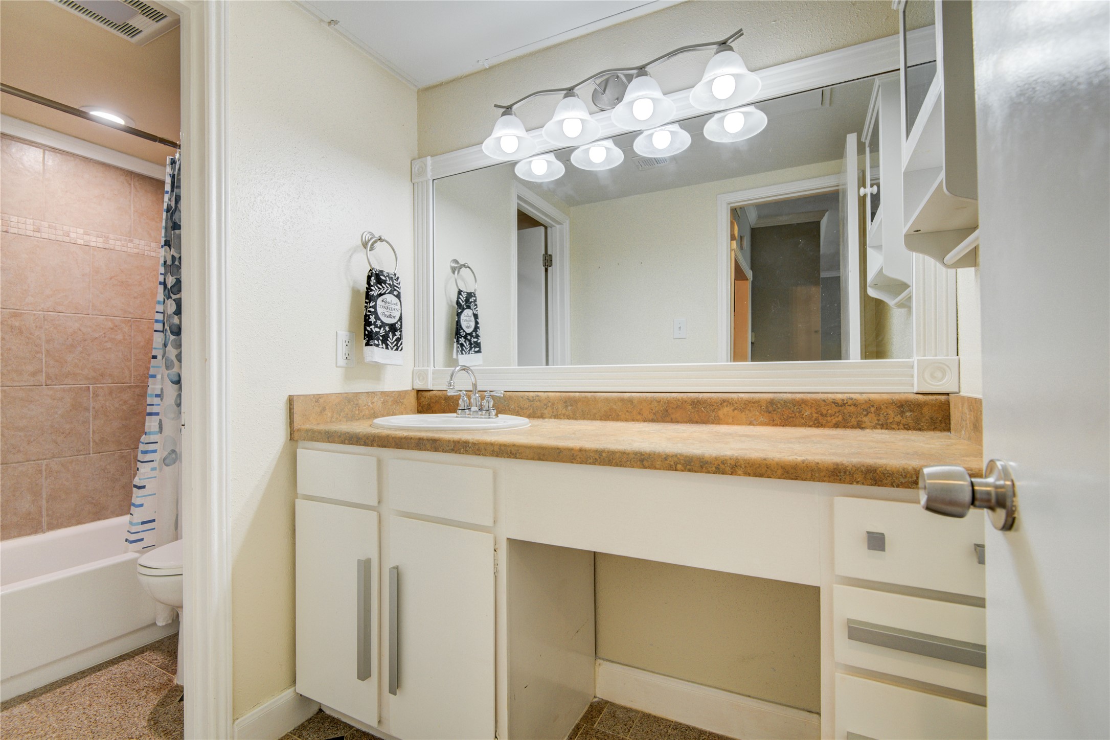 2100 Tanglewilde Street, Unit 349 Houston, TX 77063 - Photo 23 of 29 a bathroom with a sink and a mirror
