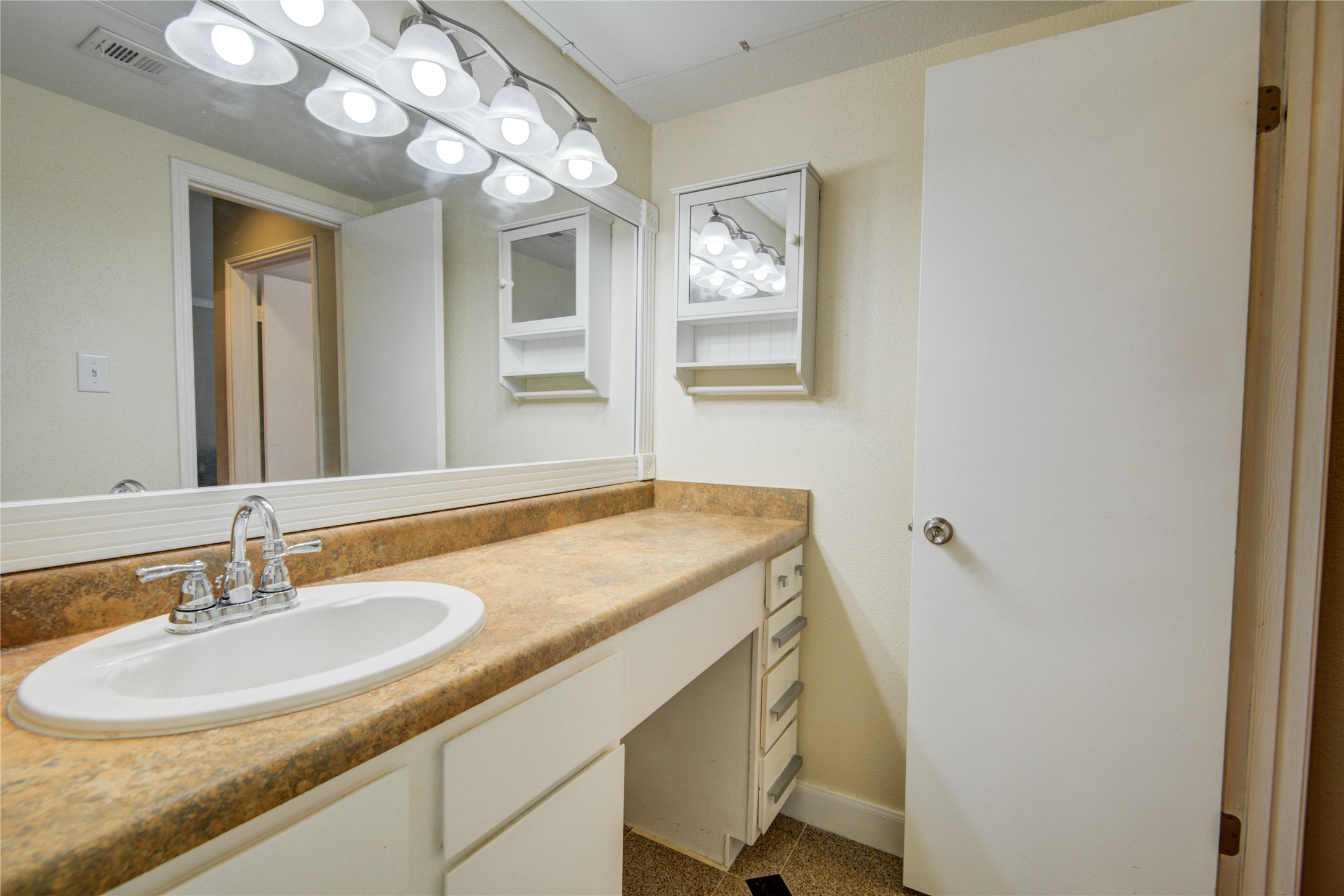 2100 Tanglewilde Street, Unit 349 Houston, TX 77063 - Photo 24 of 29 a bathroom with a sink and a mirror