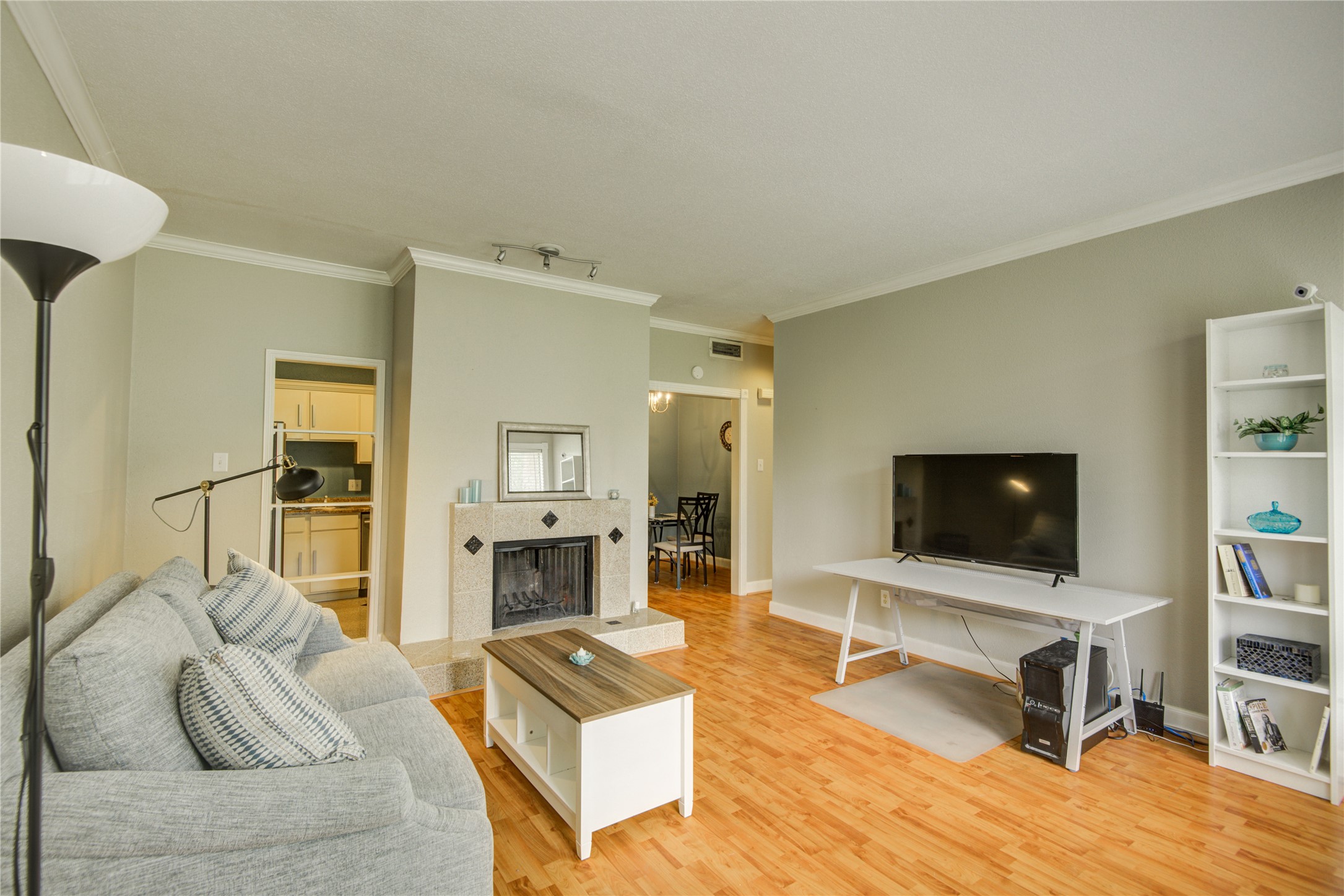 2100 Tanglewilde Street, Unit 349 Houston, TX 77063 - Photo 5 of 29 a living room with furniture and a flat screen tv