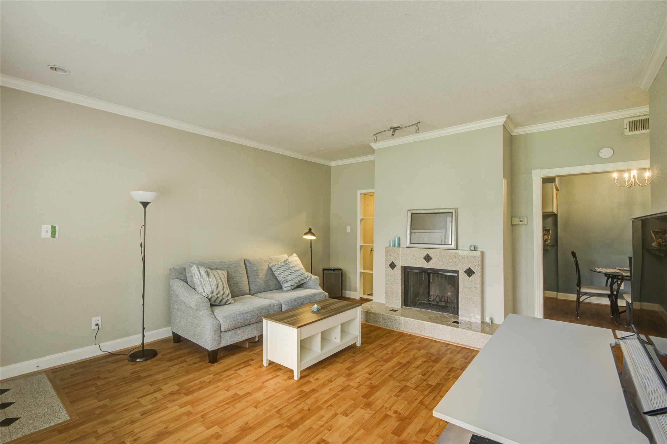 2100 Tanglewilde Street, Unit 349 Houston, TX 77063 - Photo 6 of 29 a living room with furniture and a fireplace