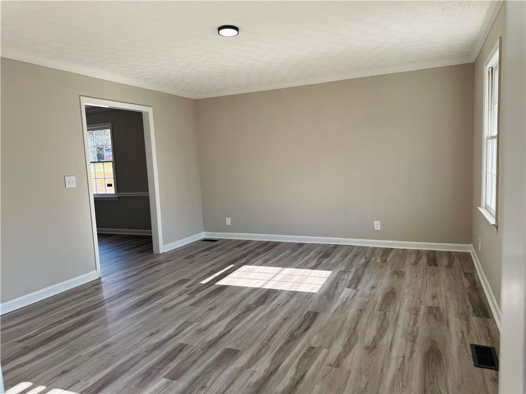 4795 Boxwood Way Northwest Acworth, GA 30102 - Photo 14 of 64 an empty room with wooden floor and windows