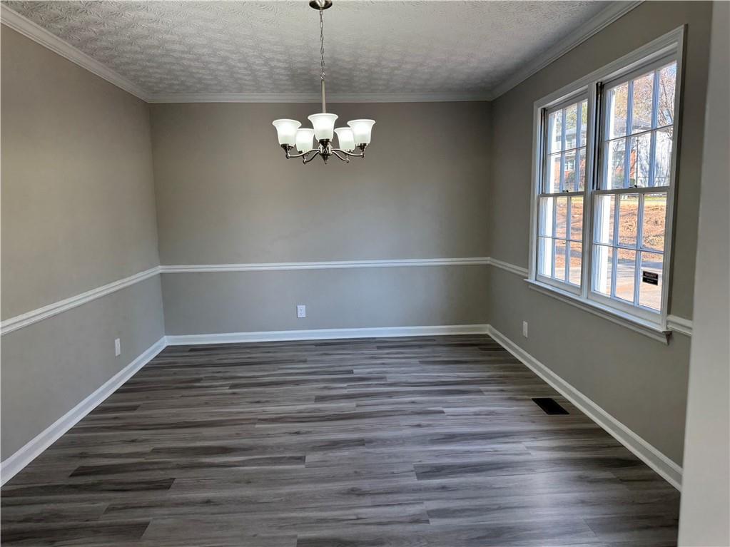 4795 Boxwood Way Northwest Acworth, GA 30102 - Photo 15 of 64 a view of empty room with wooden floor and window